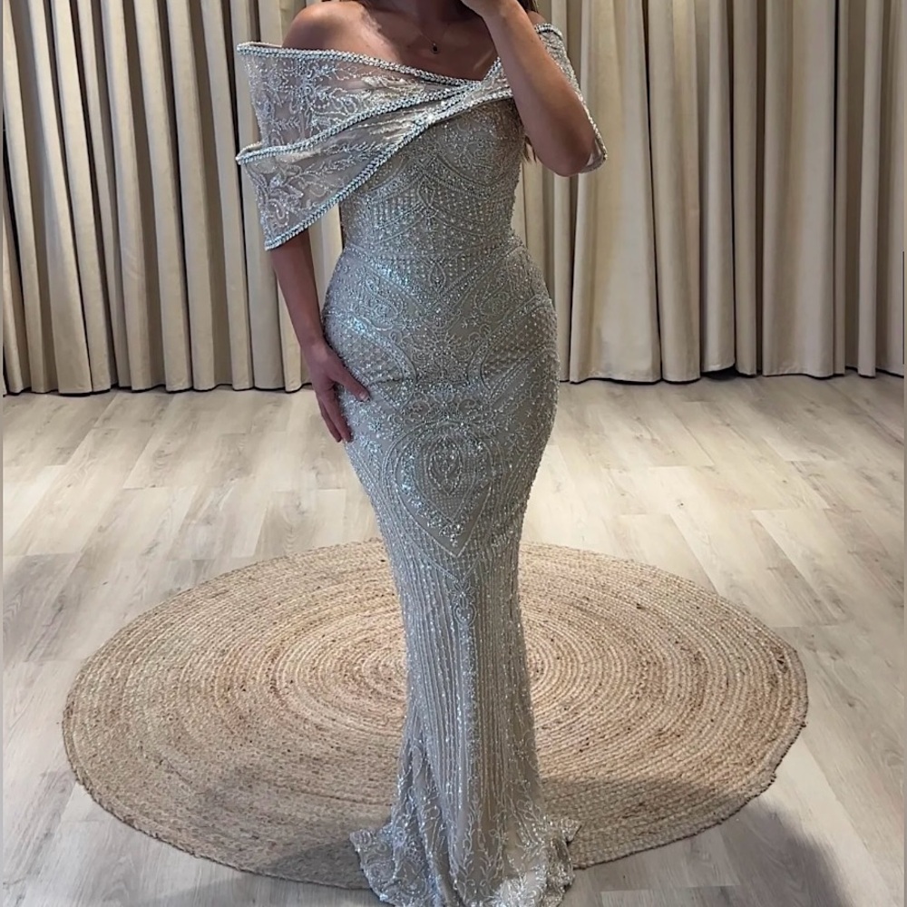 Beige heavily beaded dress with pearls and a beautiful off shoulder design.
